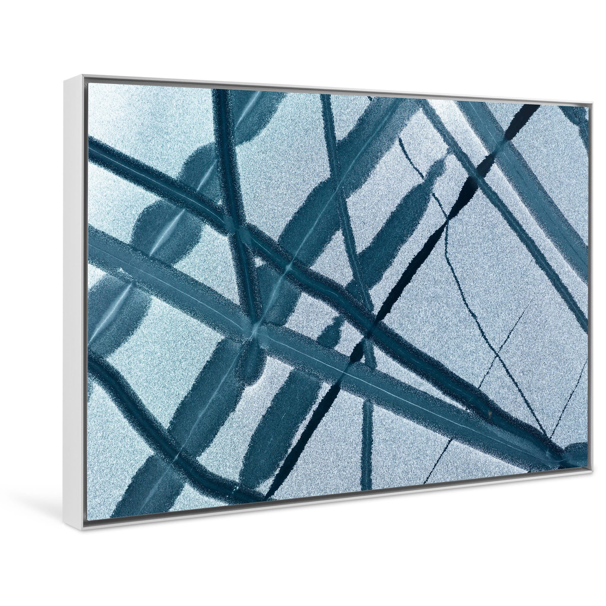 Framed photo print of monochrome frozen lake with organic holes and branching channels in Norway