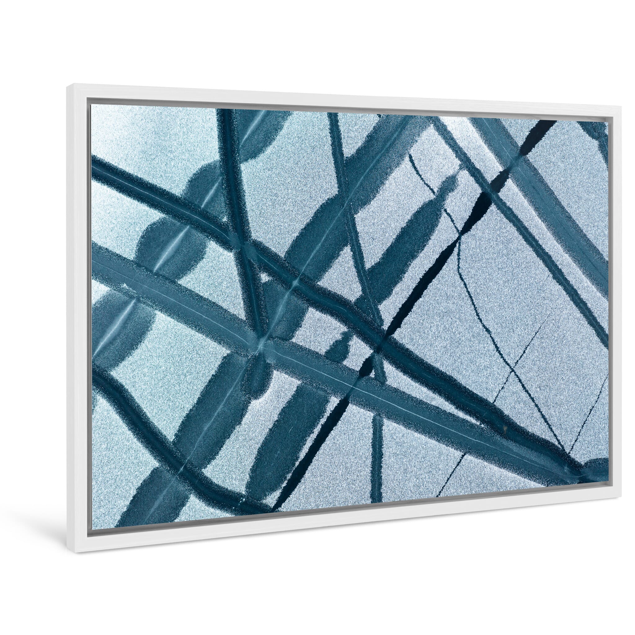 Framed photo print of frozen lake surface shaped by wind, currents, and melting