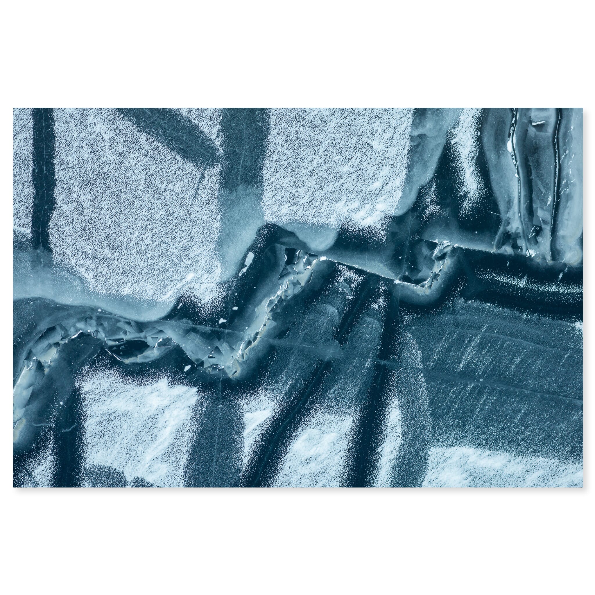 Fine art print of chaotic blue ice cracks forming maze-like patterns on a frozen lake in Norway