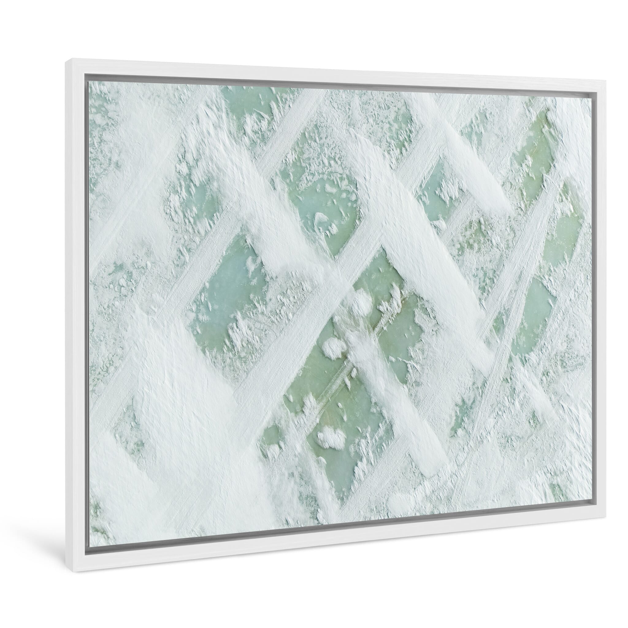 Framed photo print of layered textures across a frozen alpine surface