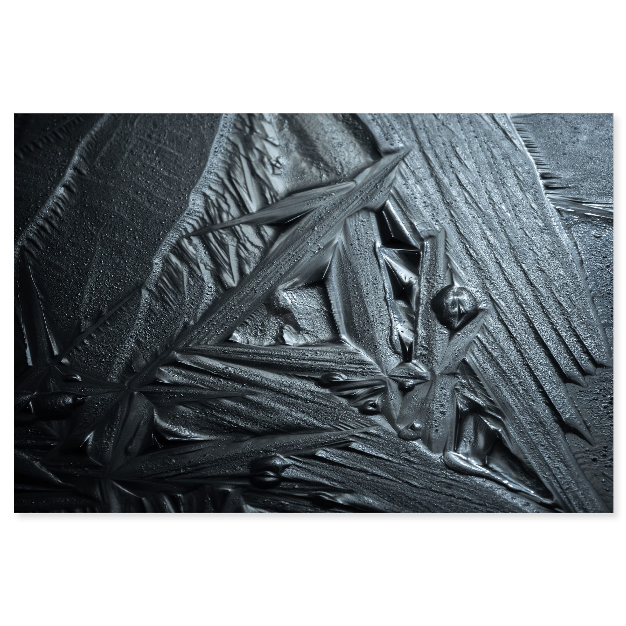 Fine art print of geometric ice patterns resembling cast iron on frozen lake in Norway