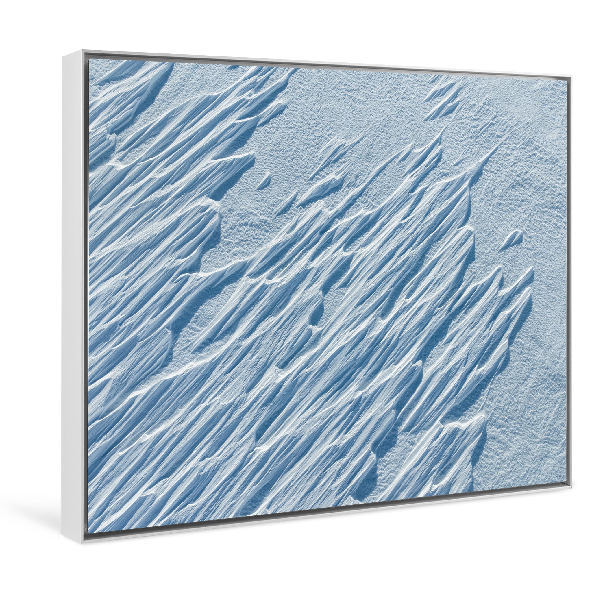 Framed photo print of white sculptural lines across an untouched winter landscape
