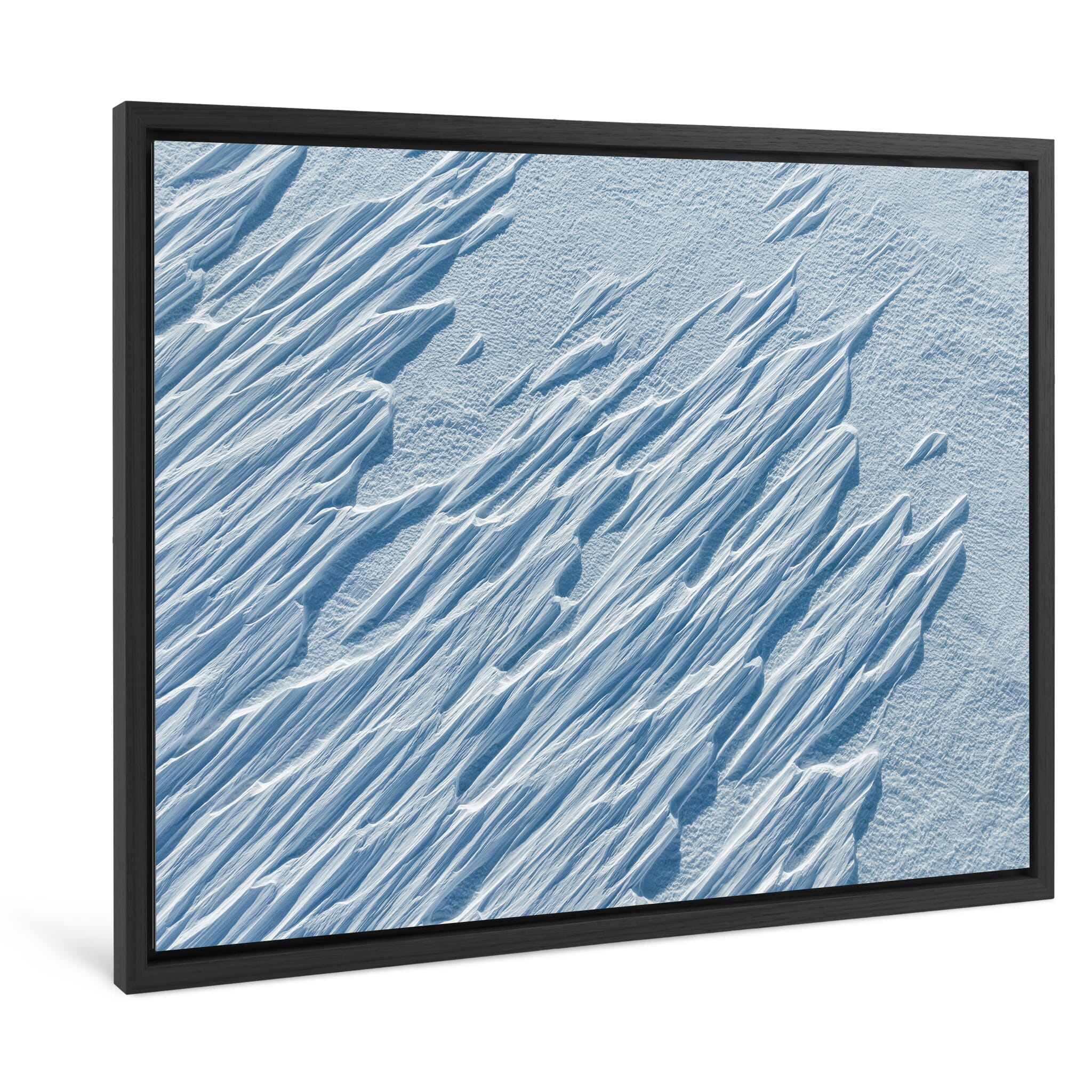 Framed photo print of frozen snow ridges shaped by icy mountain winds