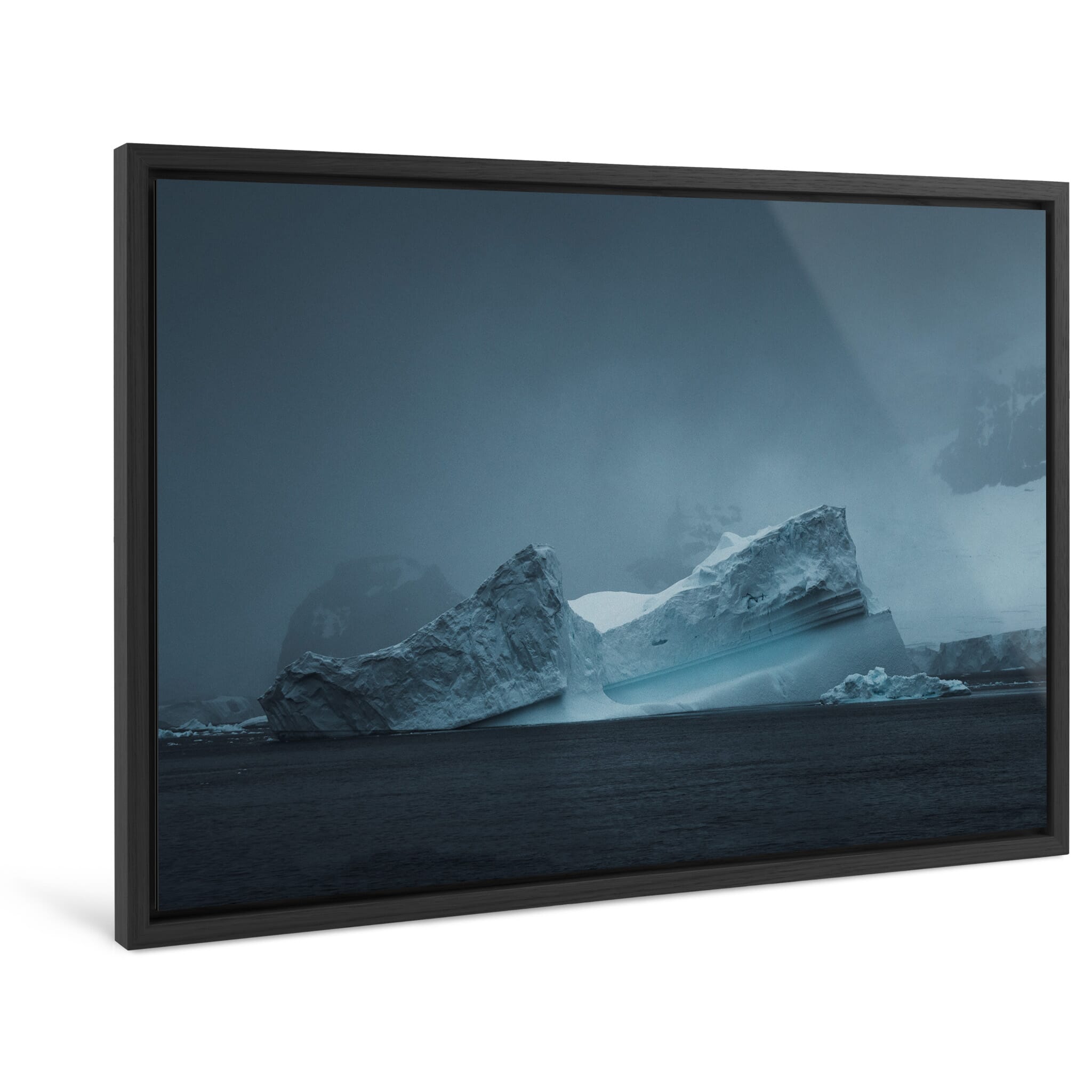 Framed photo print of towering iceberg with deep textures and moody atmosphere