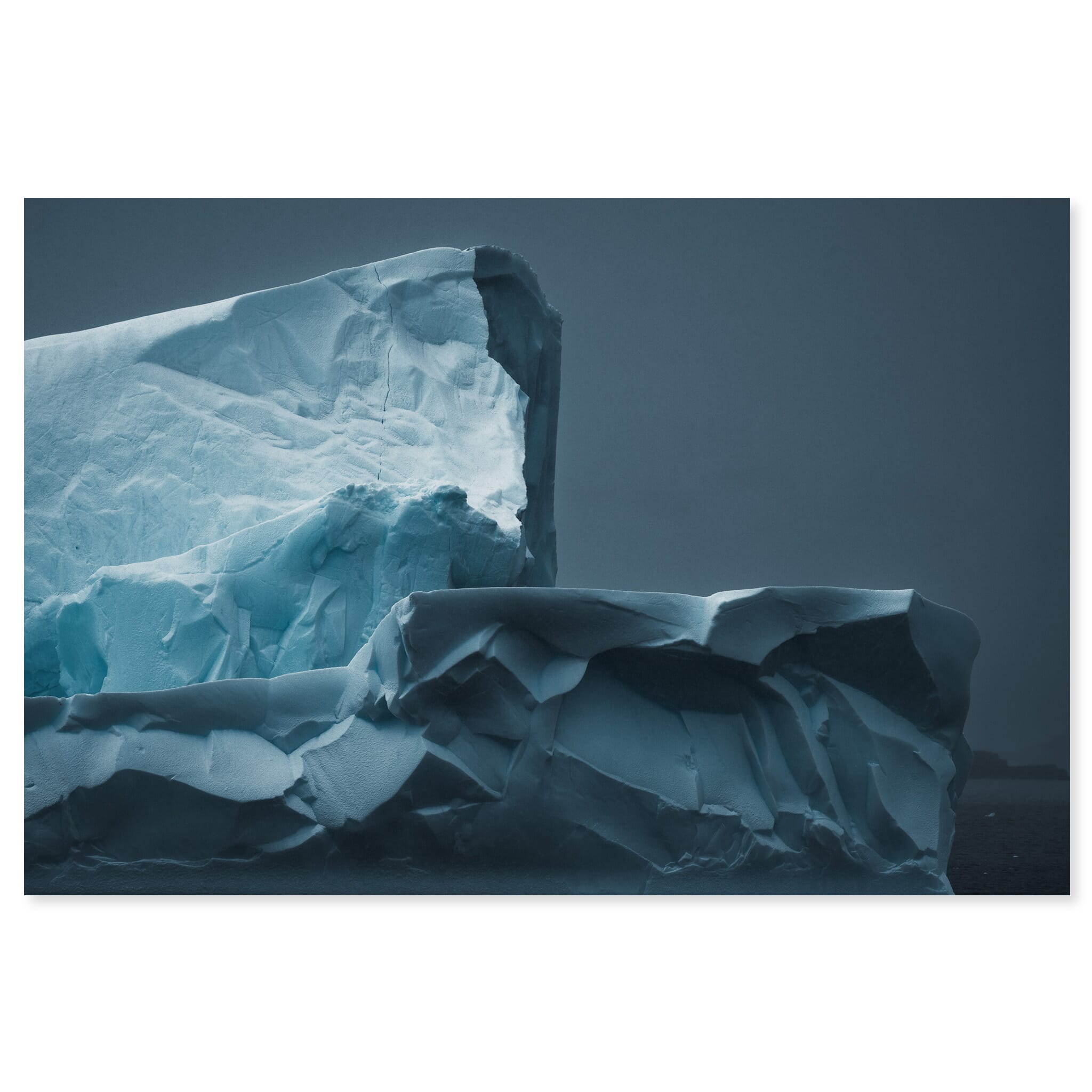 Fine art print of abstract iceberg shapes in a dark Antarctic seascape