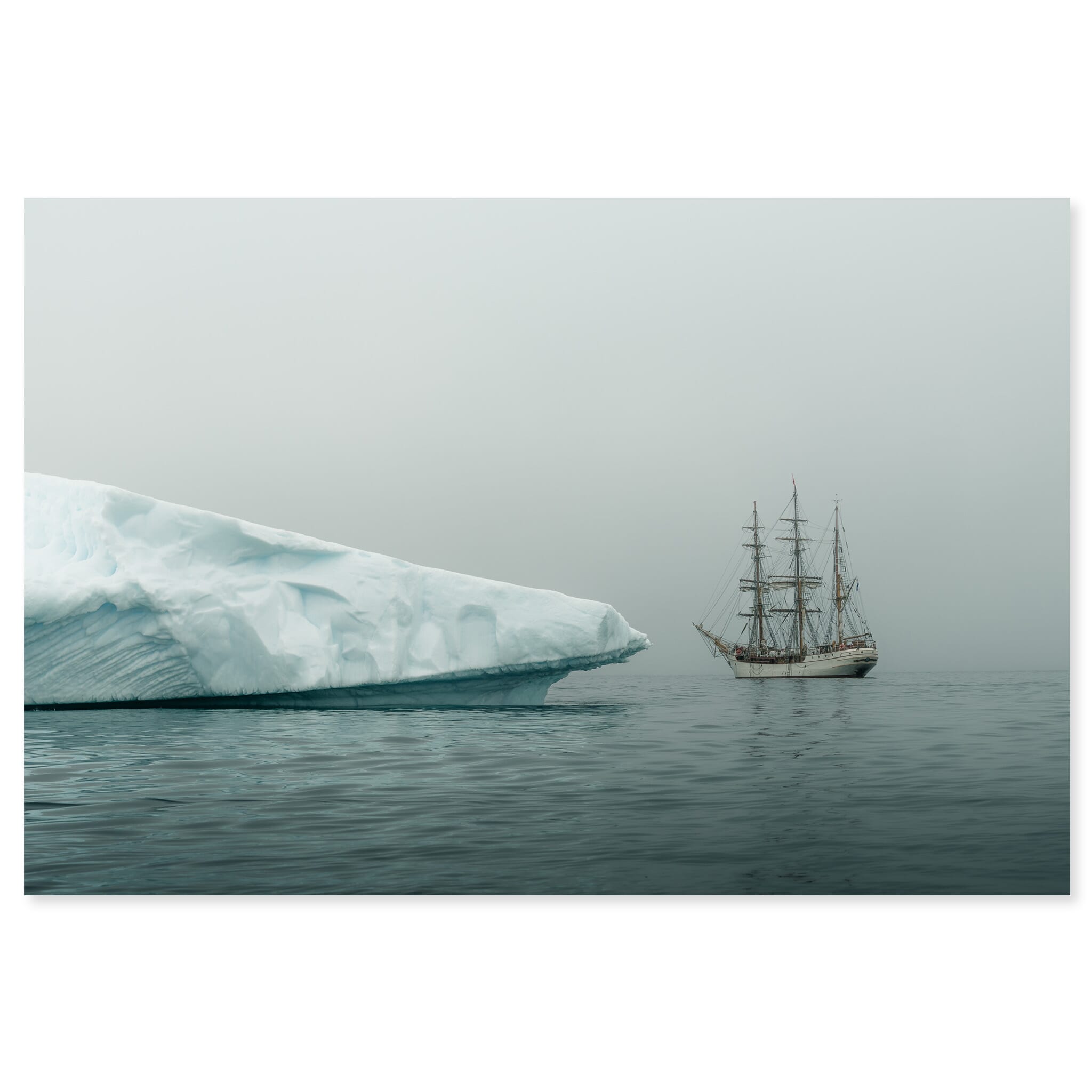 Fine art print of a large iceberg emerging from fog in Antarctica
