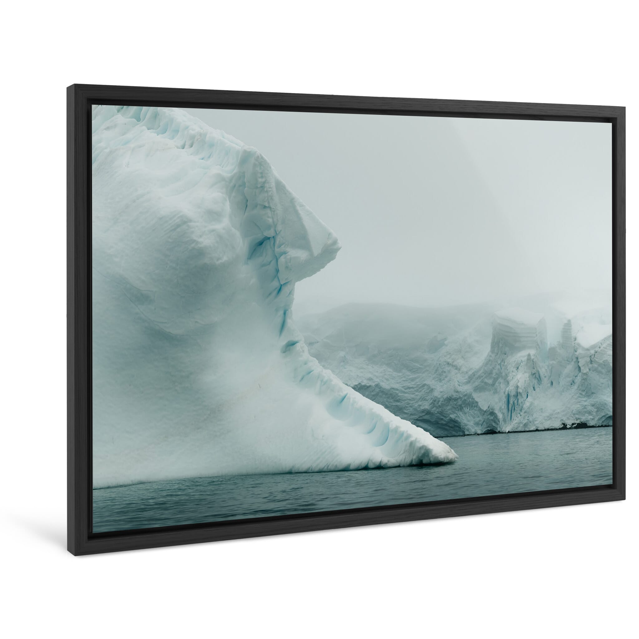 Framed photo print of ghostly ice formations emerging in a calm polar sea