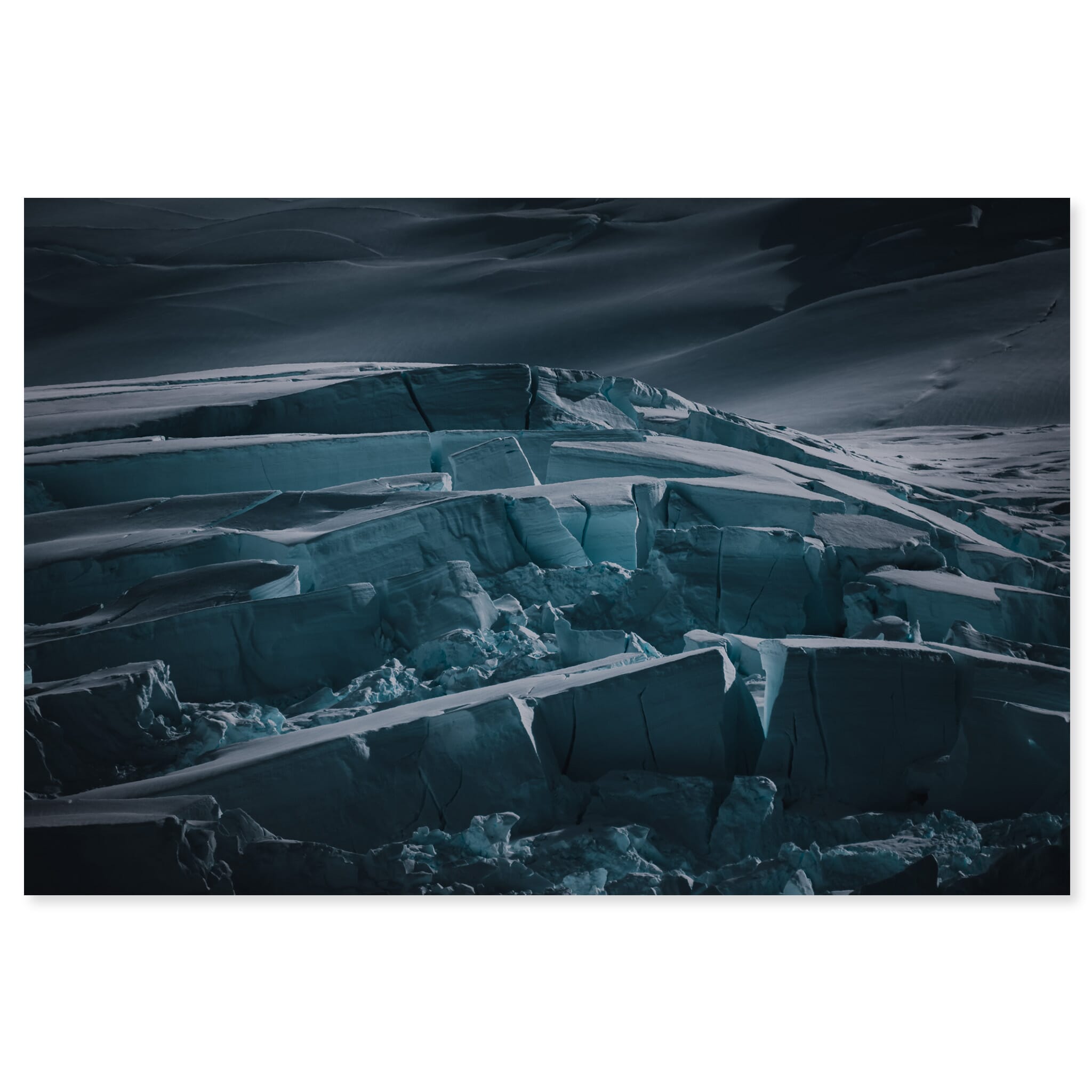 Fine art print of a dark Antarctic glacier with visible crevasses