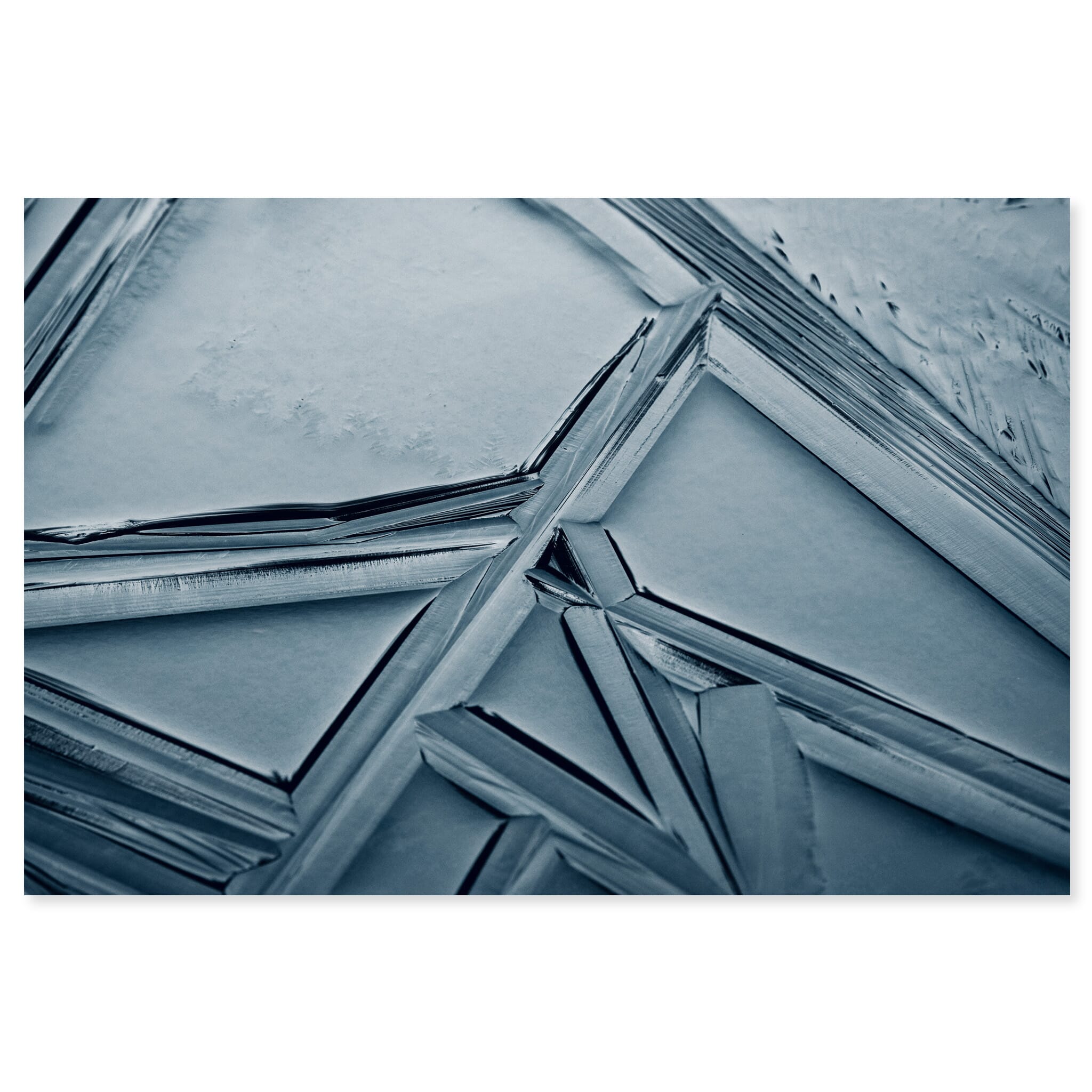 Fine art print of close-up view of geometric ice shapes on a frozen pond in Germany