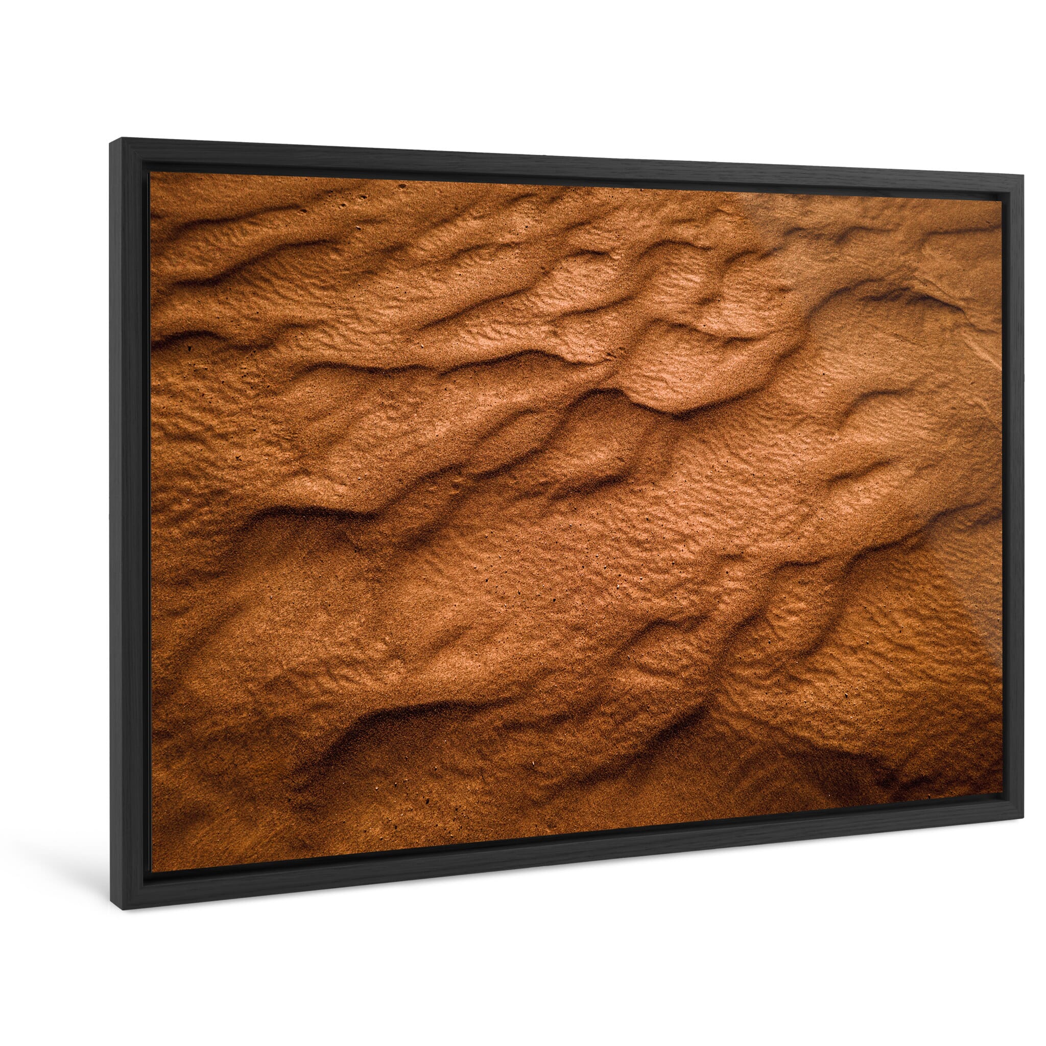 Framed photo print of shifting light shaping sandy textures