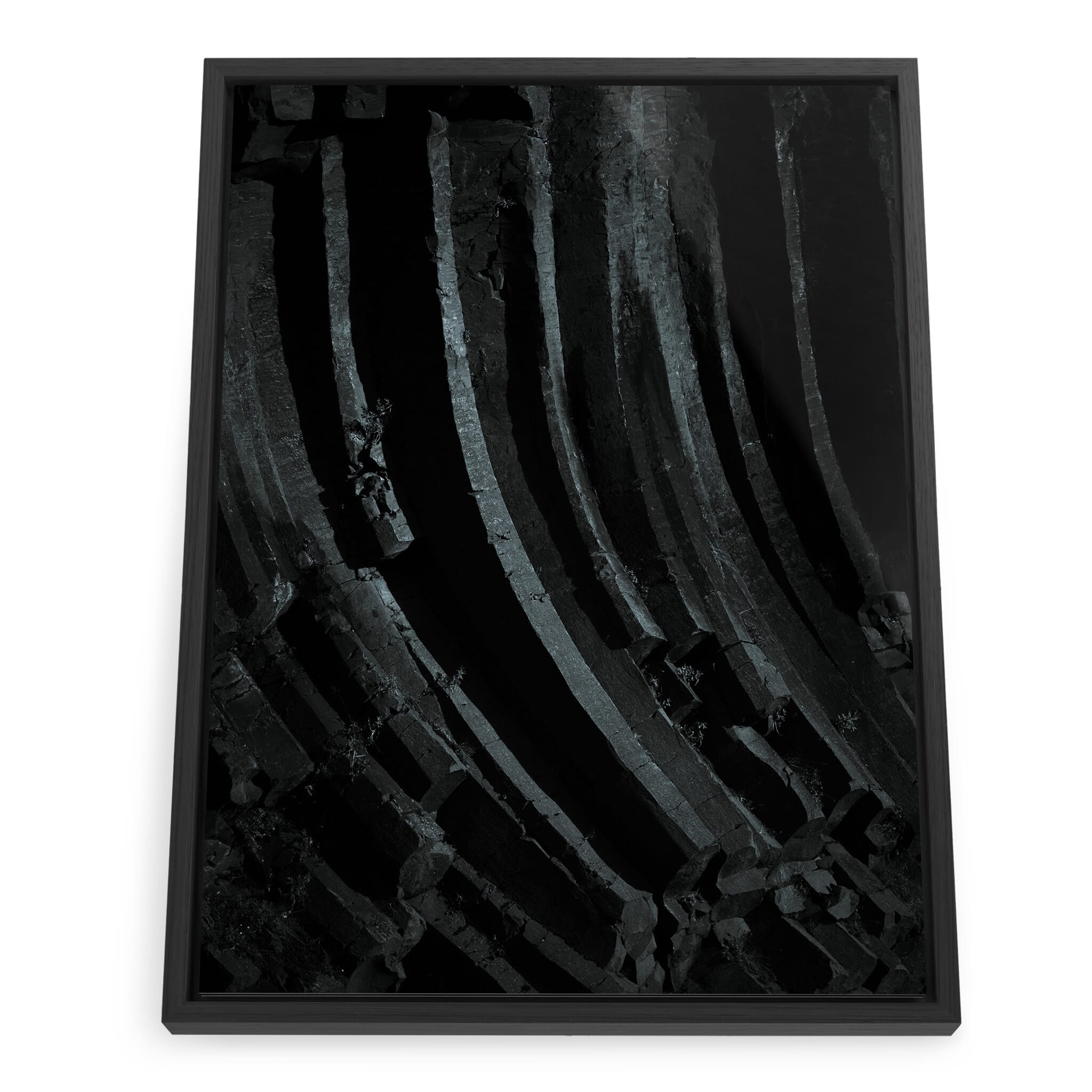 Framed photo print of curved basalt columns with dramatic lighting