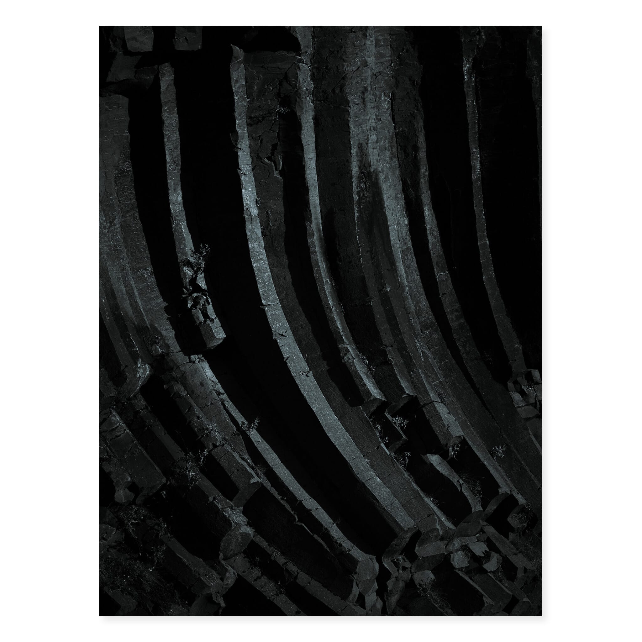 Fine art print of dark basalt formations in Iceland’s volcanic landscape