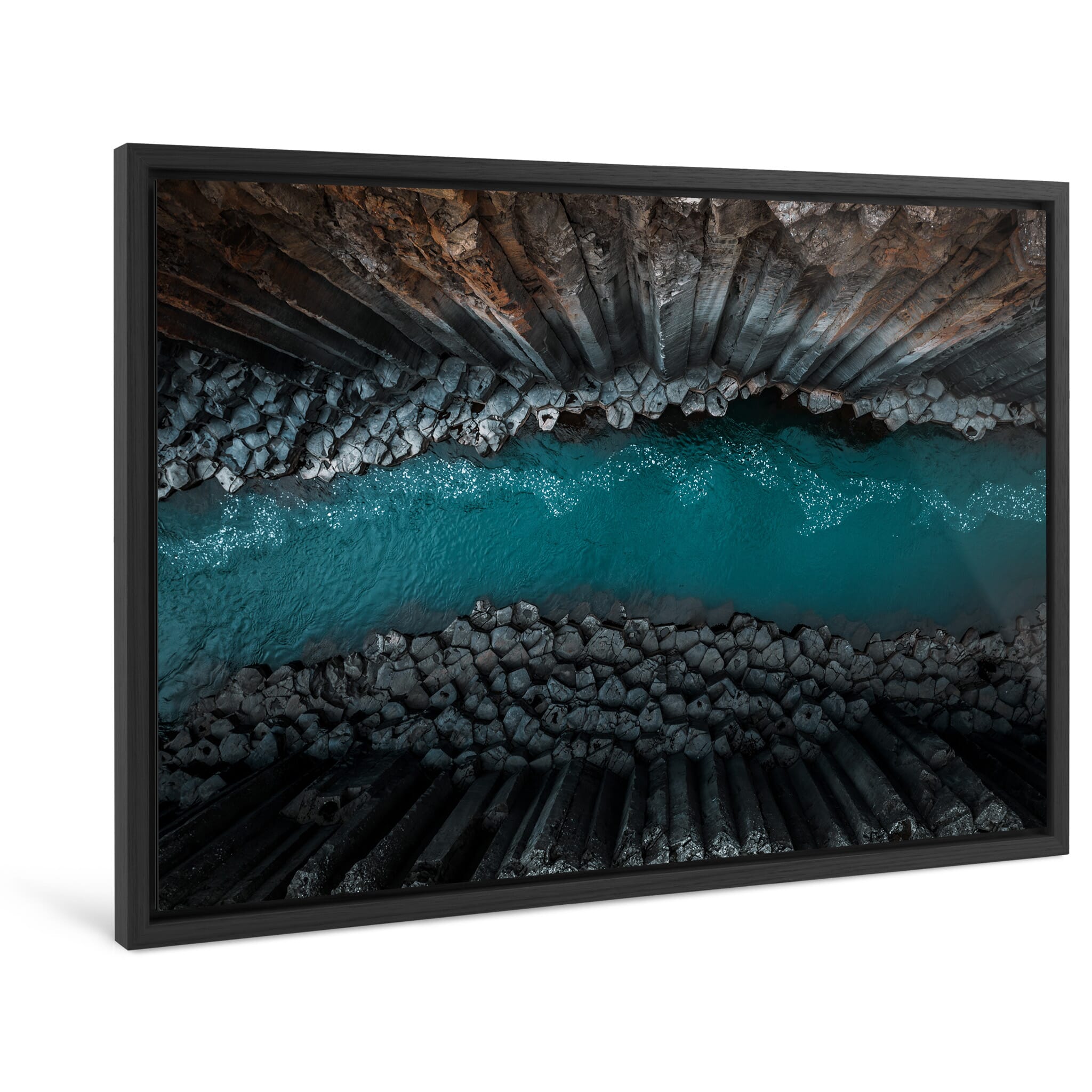Framed photo print of geometric basalt formations shaped by Iceland’s volcanic activity