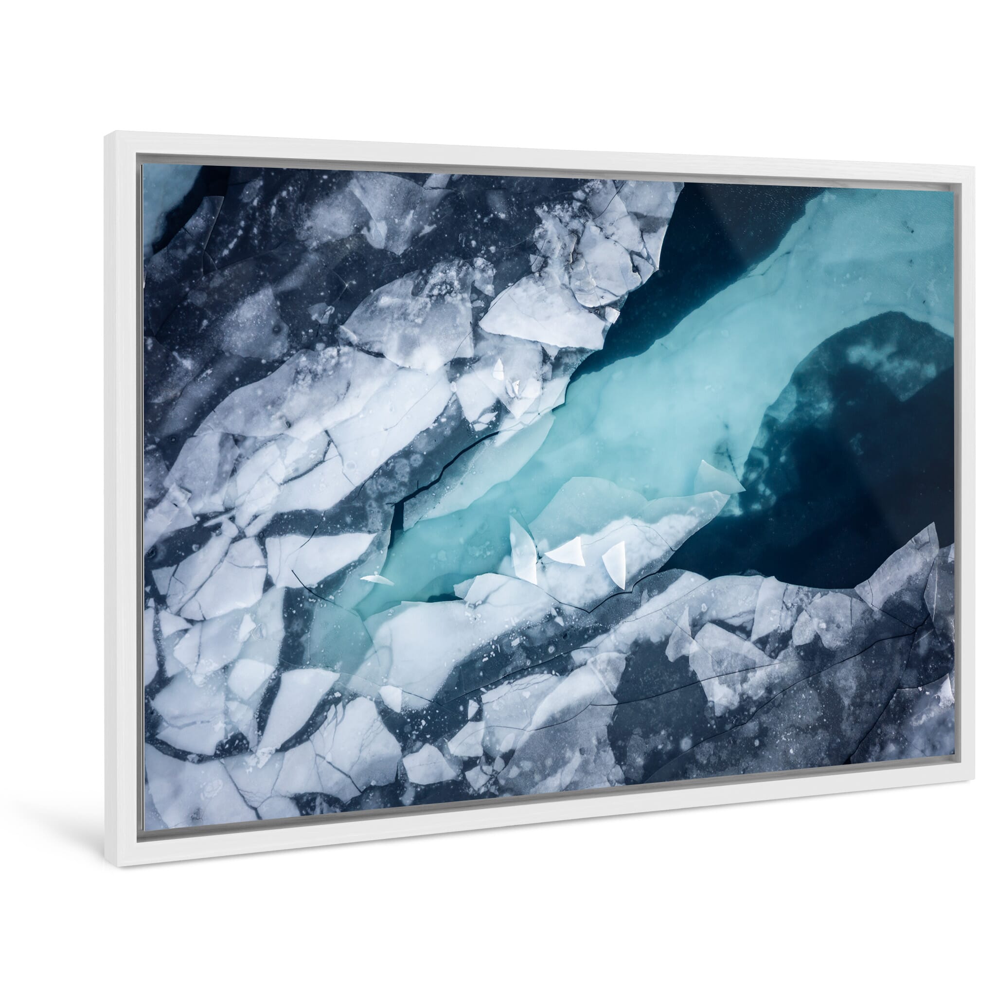 Framed photo print of jagged ice cracks and textured surfaces contrasting with dark water