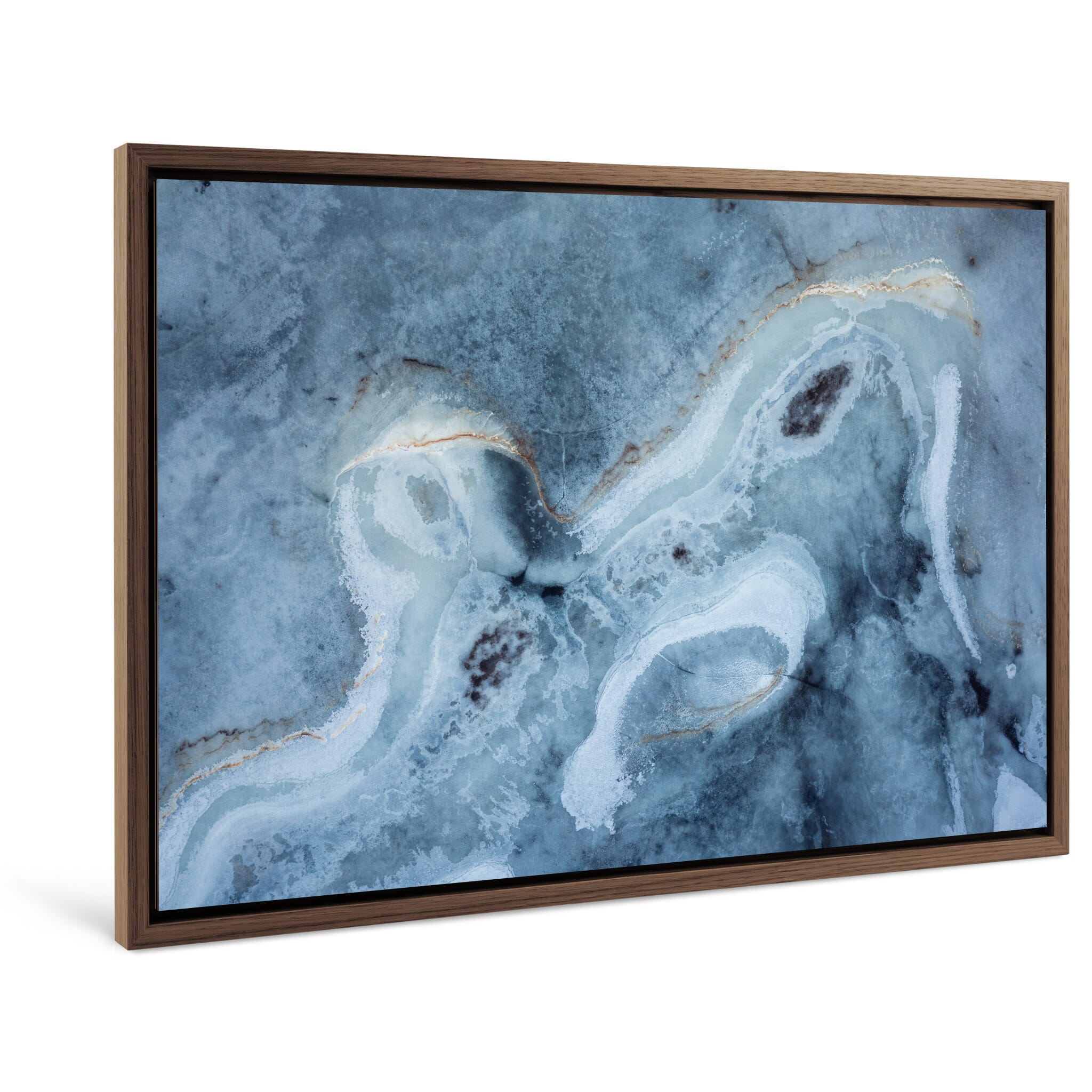 Framed landscape print of frozen ground with organic textures and subdued tones