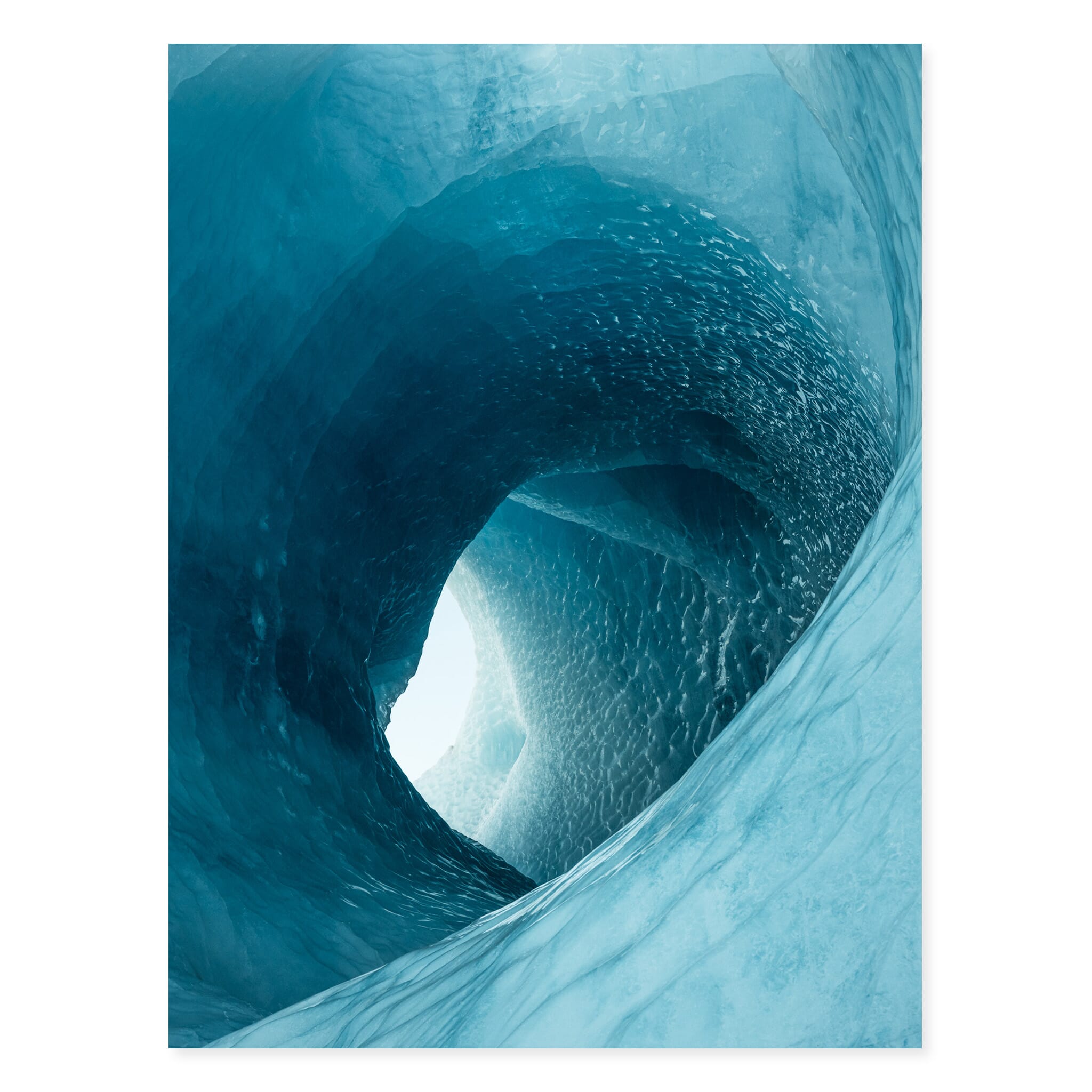 Fine art print of a glacier ice tunnel with vivid blue tones
