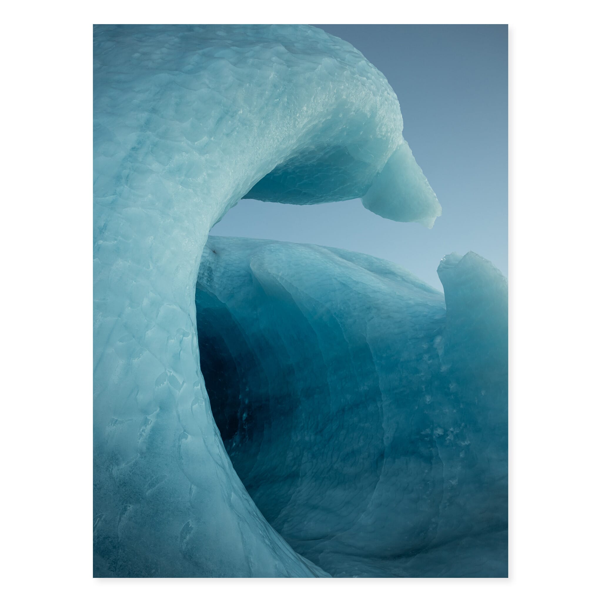 Fine art print of vivid blue glacier ice with tunnel-like formations
