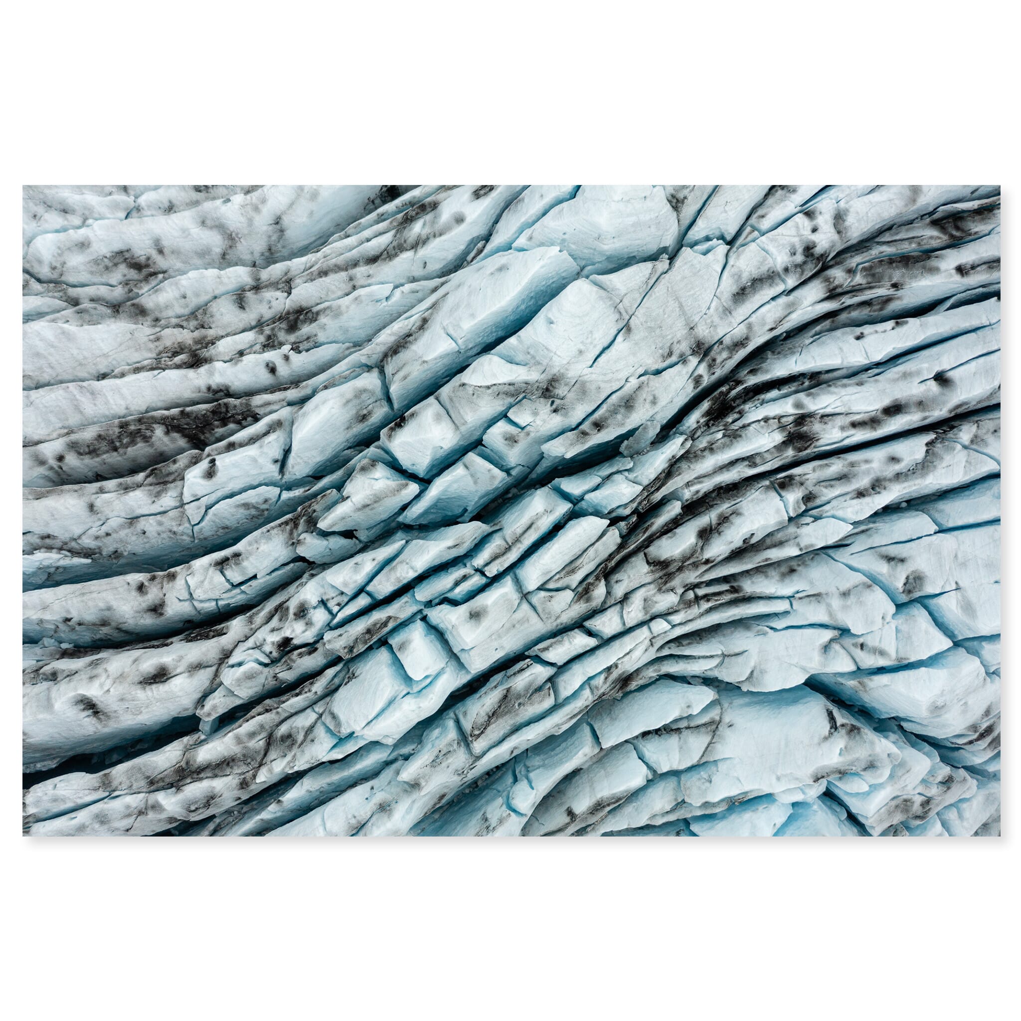 Fine art print of aerial view of glacier crevasses with volcanic ash in Iceland