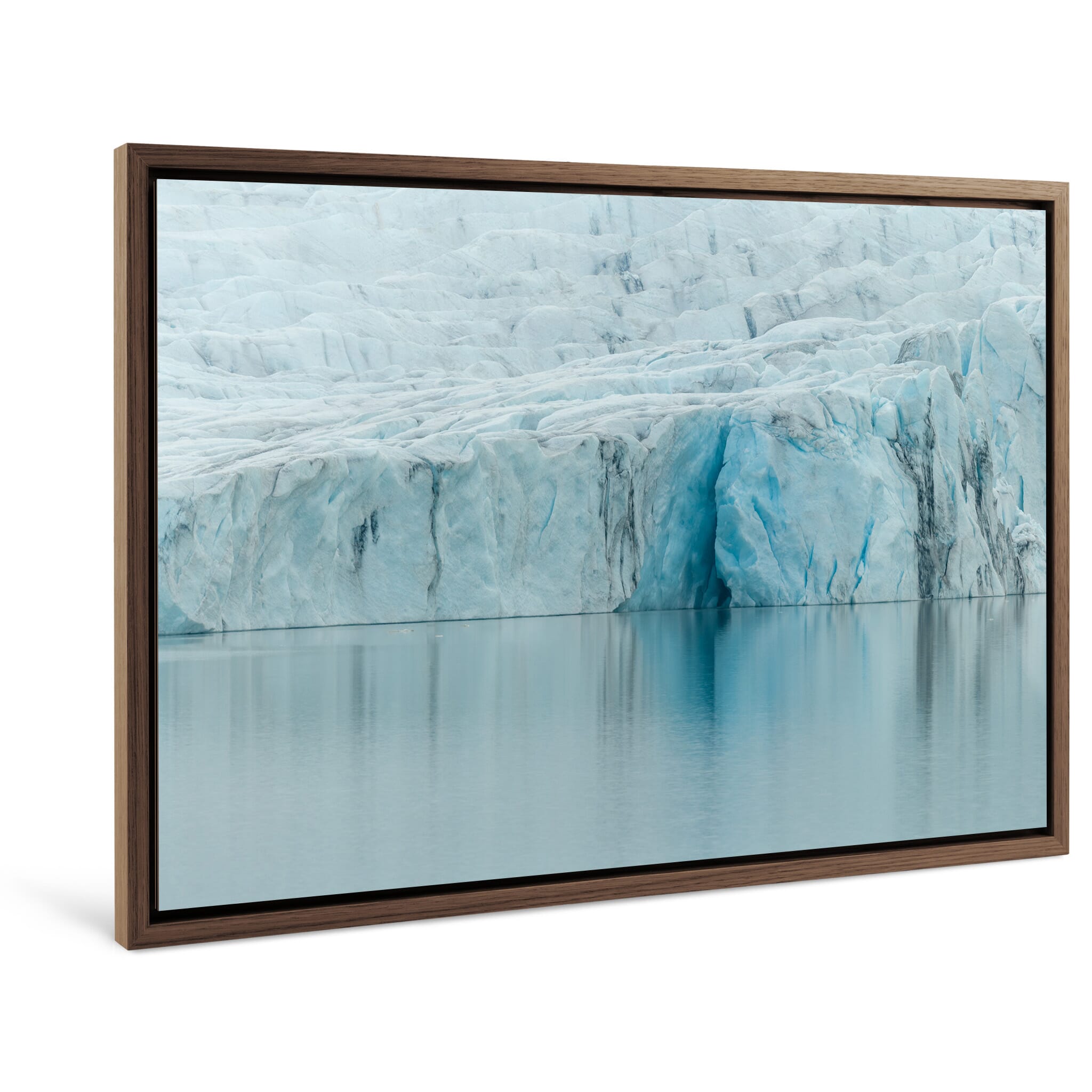 Framed photo print of rugged glacier surface meeting lagoon water in southern Iceland
