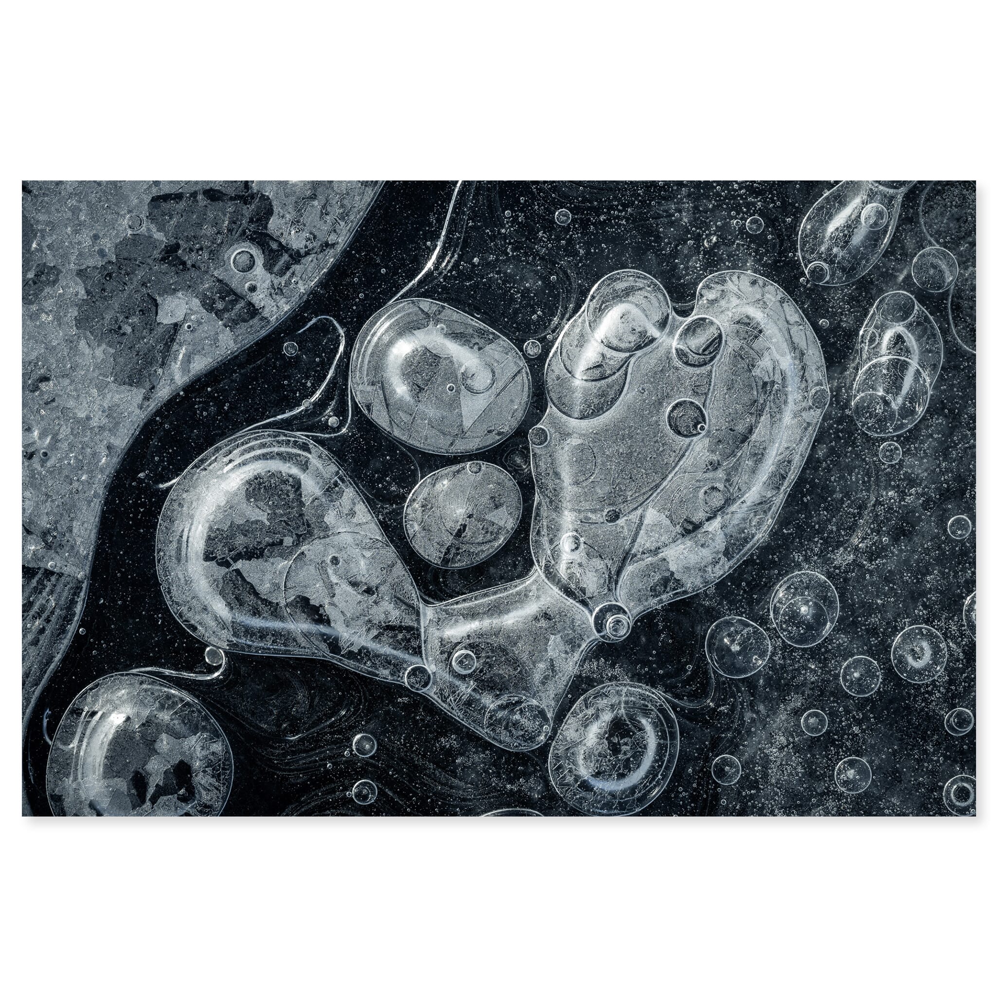 Fine art print of frozen lake in Iceland with trapped air bubbles and ice textures