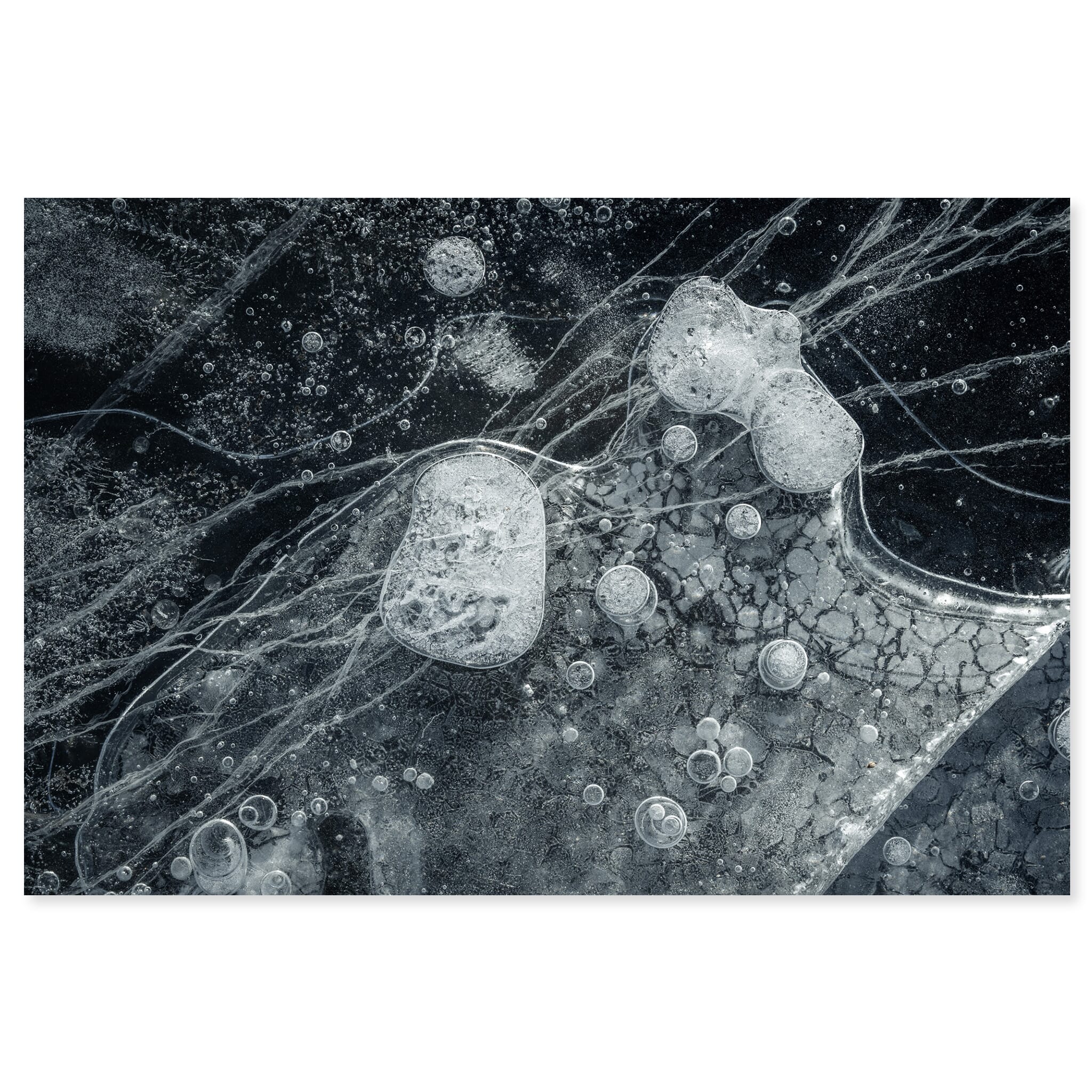Fine art print of frozen lake in Iceland with trapped air bubbles and subtle ice cracks