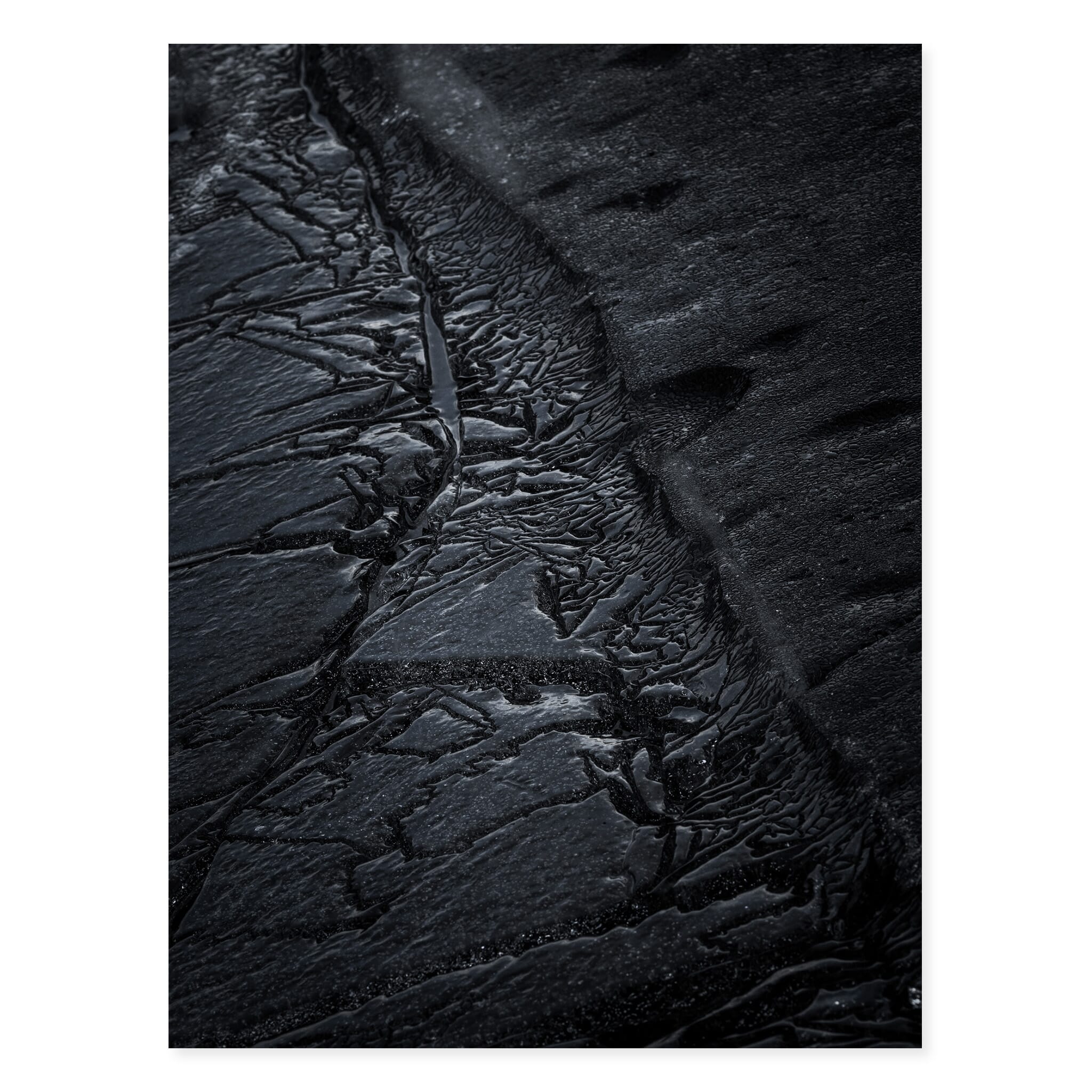 Fine art photo print of dark cracked ice in an Icelandic lake