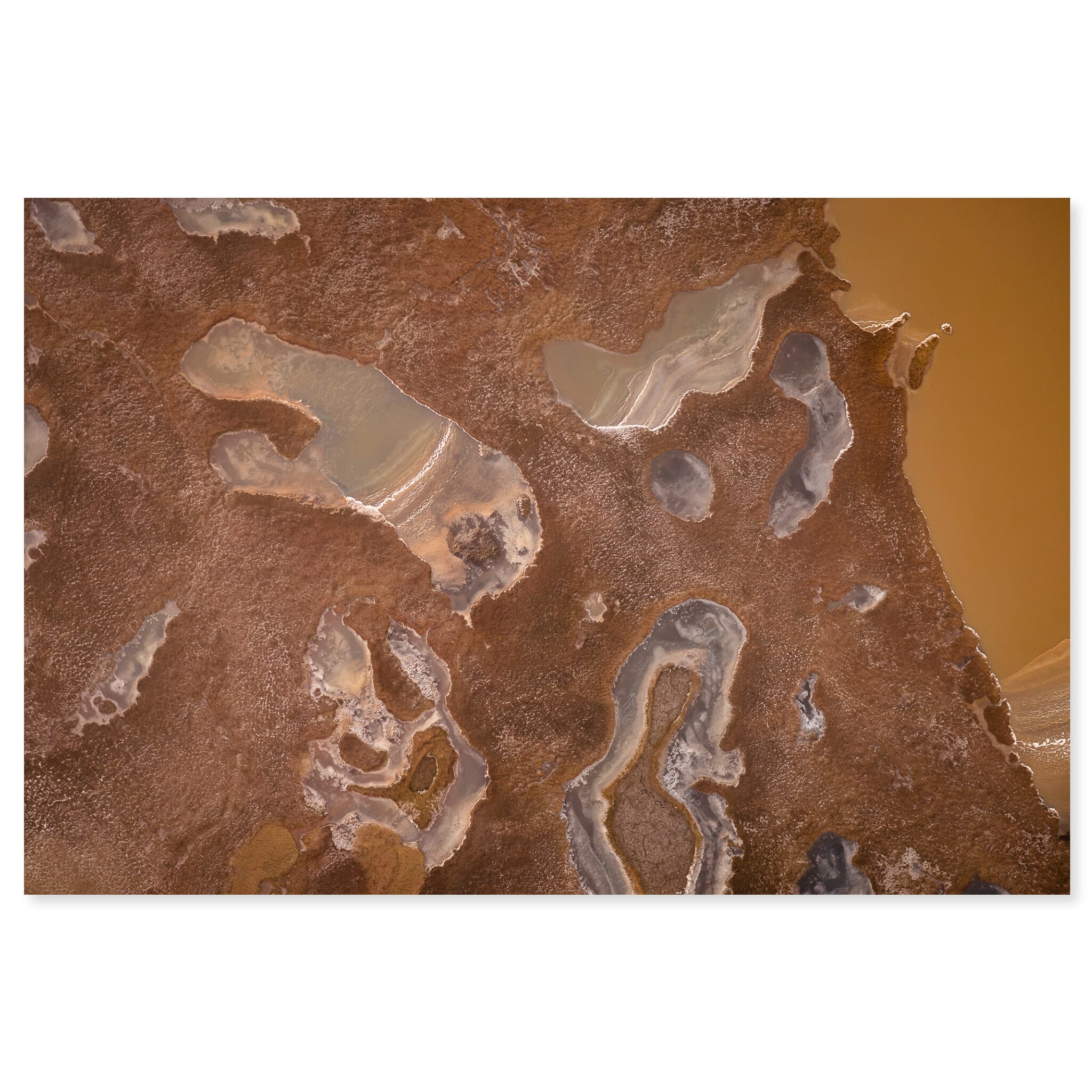 Fine art print of frozen pools with abstract patterns seen from above