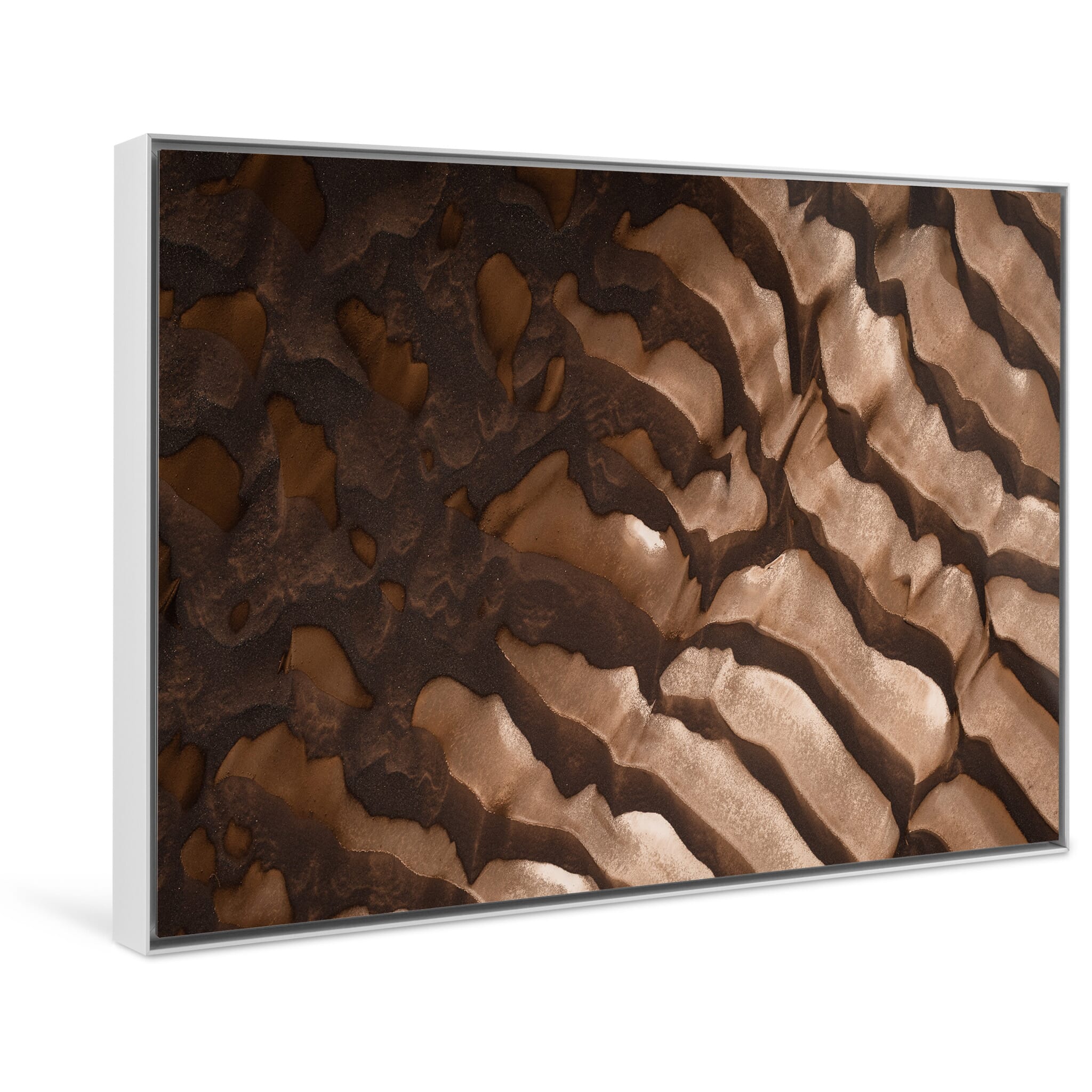 Framed photo print of braided river system seen from above in soft tones