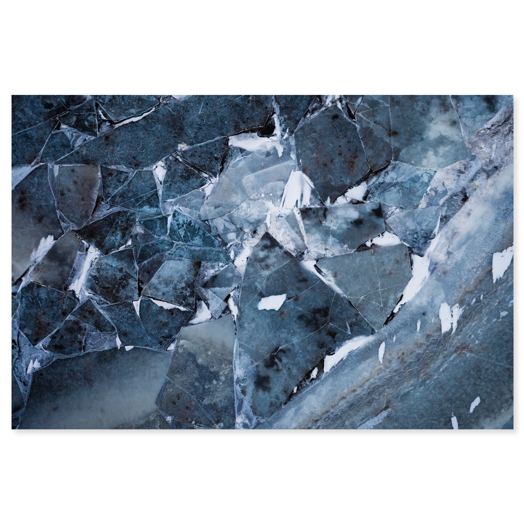 Fine art print of aerial view of textured winter ice with puzzle-like patterns in Iceland