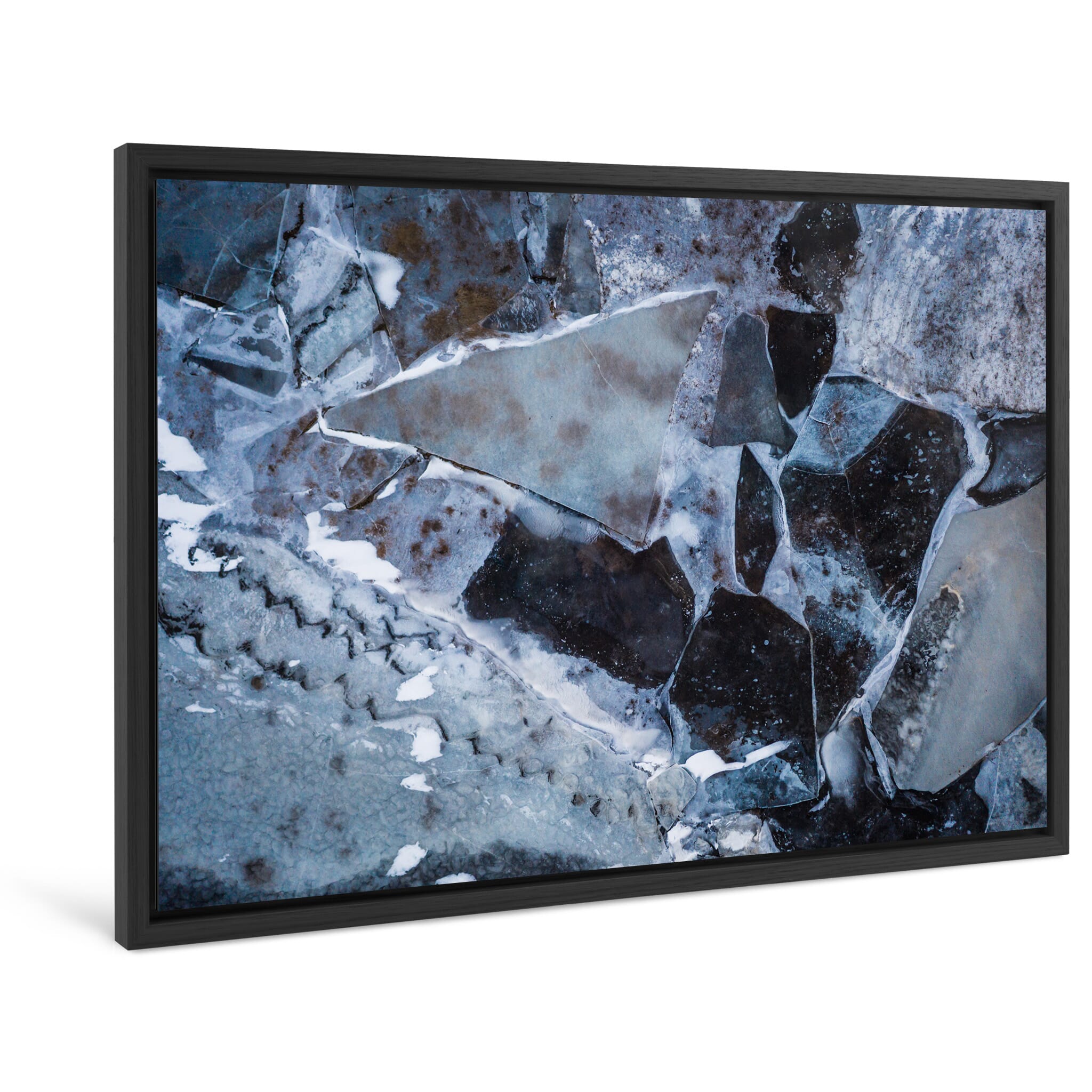Framed photo print of layered winter ice featuring tones of black, blue, and brown